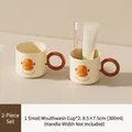 Zweiteiliges Set beige Zeichentrick-Mundspülbecher mit runden Griffen und Entenschnabel - Kleiner Becher 2 Stk