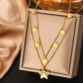 Double-layer gold necklace with butterfly and flower pendants on a jewelry display box - Gold N-75 (Flower and Butterfly)