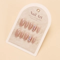 Macro detail of nude pink press-on nails with sparkling glitter and shell fragments - By1762 / Glue Type