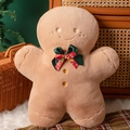 Macro shot of a gingerbread man plush pillow with a festive Christmas bow tie - Gingerbread Man with Bow