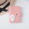 Pink PU leather 26-slot card holder with cute cartoon puppy emblem and snap closure - Dog