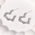 Minimalist heart-shaped stainless steel earrings with irregular silver lava design - Steel