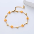 Detail showing orange and yellow flowers with heart charms on a gold-plated bracelet - Orange Flower