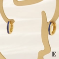 Detail view of gold-plated hoop earrings with blue enamel finish on a metal display stand - 3*12mm / Blue