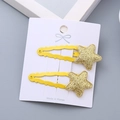 Pair of yellow glitter star hair clips for girls displayed on a white paper card - One Pair / Gold Star Pair