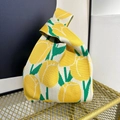 Knitted knot handbag in cream white featuring bright yellow tulip floral patterns - Yellow Tulip