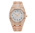 Detail of rose gold iced-out watch with Arabic numerals and luminous crystal bezel - Rose Gold