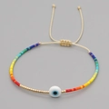 Macro shot of colorful Miyuki beads and Evil Eye charm on adjustable woven rope - Beige Rope Evil Eye Rainbow Beads (MI-B200498B)