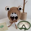 Brown knitted baby bonnet with cartoon eyes, ear flaps, and warm fleece lining - Coffee Frog - Fleece Lined