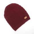 Close-up of burgundy ribbed knit beanie with brown leather logo patch and warm texture - One Size / Burgundy