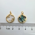 Detail shot of 18K gold plated sun moon star pendants measuring 1.8cm in diameter - 1 Piece / Gold Three Stars Abalone Shell