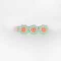 Detail of three green embroidered flowers on a ribbon-wrapped hair clip for girls - Light Green