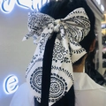 Classic black and white paisley bow hair clip decorated with white imitation pearls - White Pattern