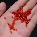 Orange red silver-lined glass seed beads held in hand for DIY jewelry making size scale - 3mm / 15g / Red