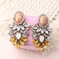 Bohemian crystal floral drop earrings with rhinestone accents on velvet jewelry box - Yellow
