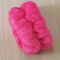 Pair of soft pink plush wristbands for face washing placed on a natural wood surface - Rose Red Wristbands 1 Pair