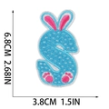 Detail view of Easter bunny S-letter embroidery patch in blue and pink, 6.8cm x 3.8cm - Letter S