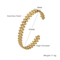 Macro detail of high polished golden stainless steel cuff bracelet with textured surface - Gold Bangle (B273)