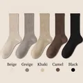 Five pairs of ribbed knit mid-calf cotton socks in beige, khaki, and neutral earth tones - One Size