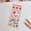 Dettaglio di simpatici adesivi in PVC con fragole e conigli per decorare diari e tazze - Coniglio Arcobaleno