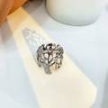 Artistic shadow cast by a silver hollow Tree of Life stainless steel ring on white surface - Adjustable Open / Silver Tree
