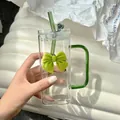 Square glass cup with green handle and lime green bow decoration including a straw - Green Bow Tie + Straw + Transparent Lid