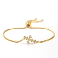 Detail of adjustable gold cross bracelet with shimmering zircon stones and box chain link - Style 13