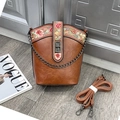 Brown bucket bag with pink floral embroidery and adjustable leather strap - Tan