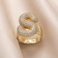 Gold plated open ring with sparkling cubic zirconia S-shaped design on beige satin - Small / Letter S