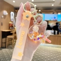 Porte-clés lapin créatif avec dragonne en silicone orange et paillettes flottantes - Ours Sable Mouvant - Sucette / Orange