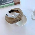 Pleated knot headband in beige gold finish shown on a decorative cup with books - Pleated Knot Khaki (FK-B107 Khaki)