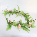 Detailed view of pink silk flowers and green foliage vines for wedding arch decoration - 110cm / Pink
