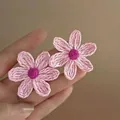 Detailed shot of handmade woven floral earrings featuring pink petals and raffia texture - 7# Steel Needle Pink Flower
