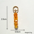Orangefarbener Kristallperlen-Anhänger mit 4 vertikalen Perlen und goldenem Ringverbinder - Glas/Legierung / Orangene Kristallperlen Anhänger