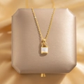 Gold-plated safety lock necklace with white mother of pearl inlay and sparkling zircons - Lock