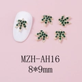 Detail of green leaf nail charms with gold metal base and rhinestones, 8x9mm size - Gold Base Green Rhinestone (AH16)