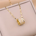 Macro view of gold necklace with cylindrical pendant pavé-set with clear cubic zirconia stones - Little Waist Style (8849) / White