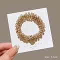 Champagne beaded hair tie bracelet with gold pendant and 5.5cm diameter display - Champagne Crystal Tag Scrunchie