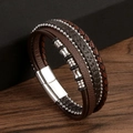 Detailed view of multilayer brown braided leather bracelet with silver magnetic buckle - Coffee