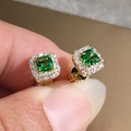 Elegant emerald green square zircon stud earrings with a halo of small white diamonds - Gold Plated + Dark Green Zirconia