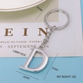 Polished silver metal keychain featuring capital letter D with sturdy keyring and chain - Letter-D