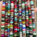 Handheld view of multi-color natural stone abacus beads for DIY jewelry making - 4*6mm 1 Strand (Approx 90pcs) / Mixed Colors