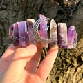 Close-up of handmade raw amethyst crystal crown with silver moon and star pendant - Amethyst
