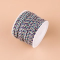 Braided purple and teal cotton cord with gold tinsel thread on a white plastic spool - No.15 Purple Blue
