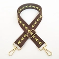 Detail of adjustable woven shoulder strap with yellow chevron pattern and gold hardware - Light Coffee Arrow
