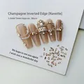 Macro detail of 1.5x3mm marquise champagne nail rhinestones on textured white background - Champagne Marquise 1.5x3 (XY-1014)