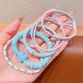 Elastische Baby Haargummis Set mit blauen Herzanhängern und Schleifen in Pastellfarben - 5er-Pack / Blau