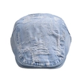 Detailed view of light blue denim beret featuring vintage distressed fraying and ripped holes - Light Blue