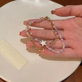 Colorful beaded bracelet with gold chain and white star pendant on model hand - Colorful Star Double Layer Style (HB1364)