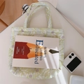 Top view of a floral quilted tote bag on a white table with natural window light shadows - Green Leaf Purple Floral